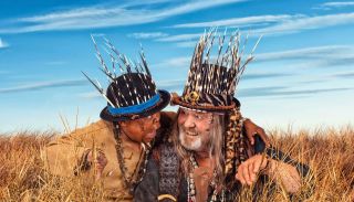 1653293313 3 son of bones Alfred Ntombela leon schuster men crouching in bush billboard