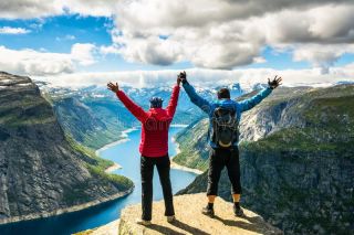 couple standing against amazing nature view w